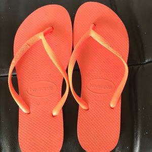 Neon orange Havaianas flip flops
